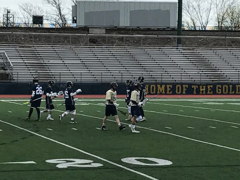 Malden and Winthrop players on the field.