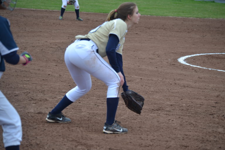 Senior Caitlyn Leonard going to catch the ball on third base.