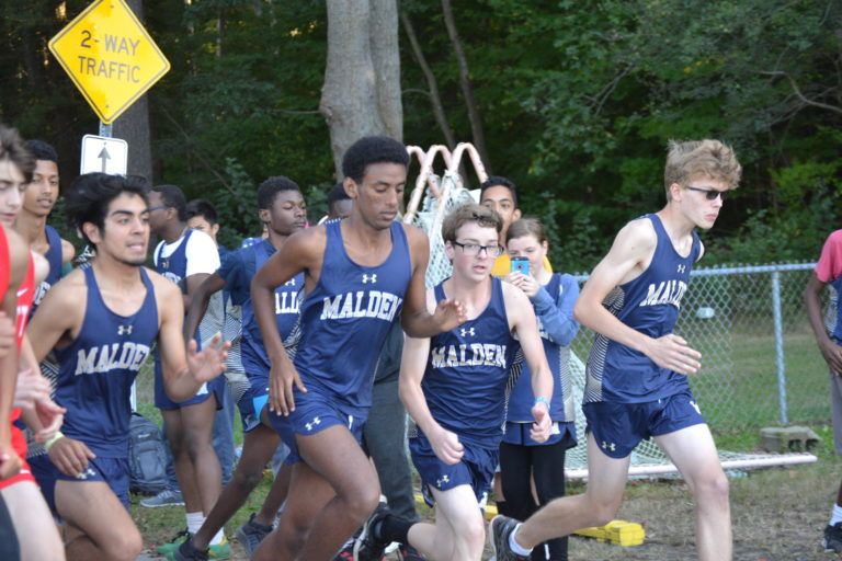 The Cross Country team running during a meet. Photo by DeVin Lemay