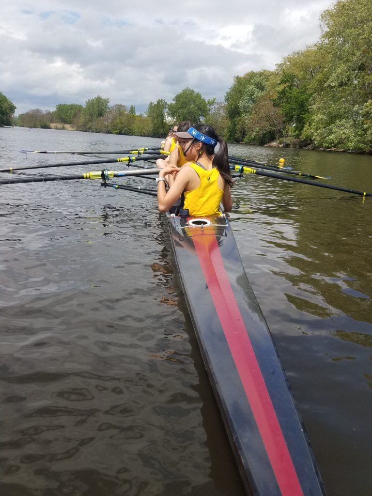 Girls Varsity 1 boat at the start of their Race Photo By Ana Pirosca