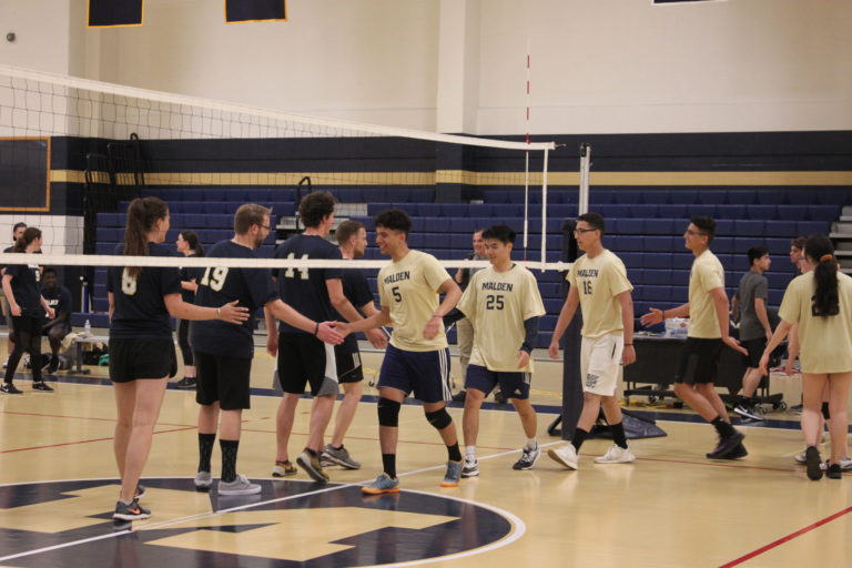 Both teams shaking hands after the second set