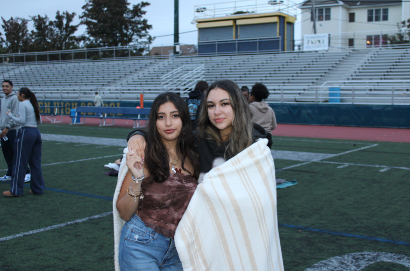 Seniors Anais Perez and Juliana Rosa De Oliveira keeping warm. THOMAS TIERNEY