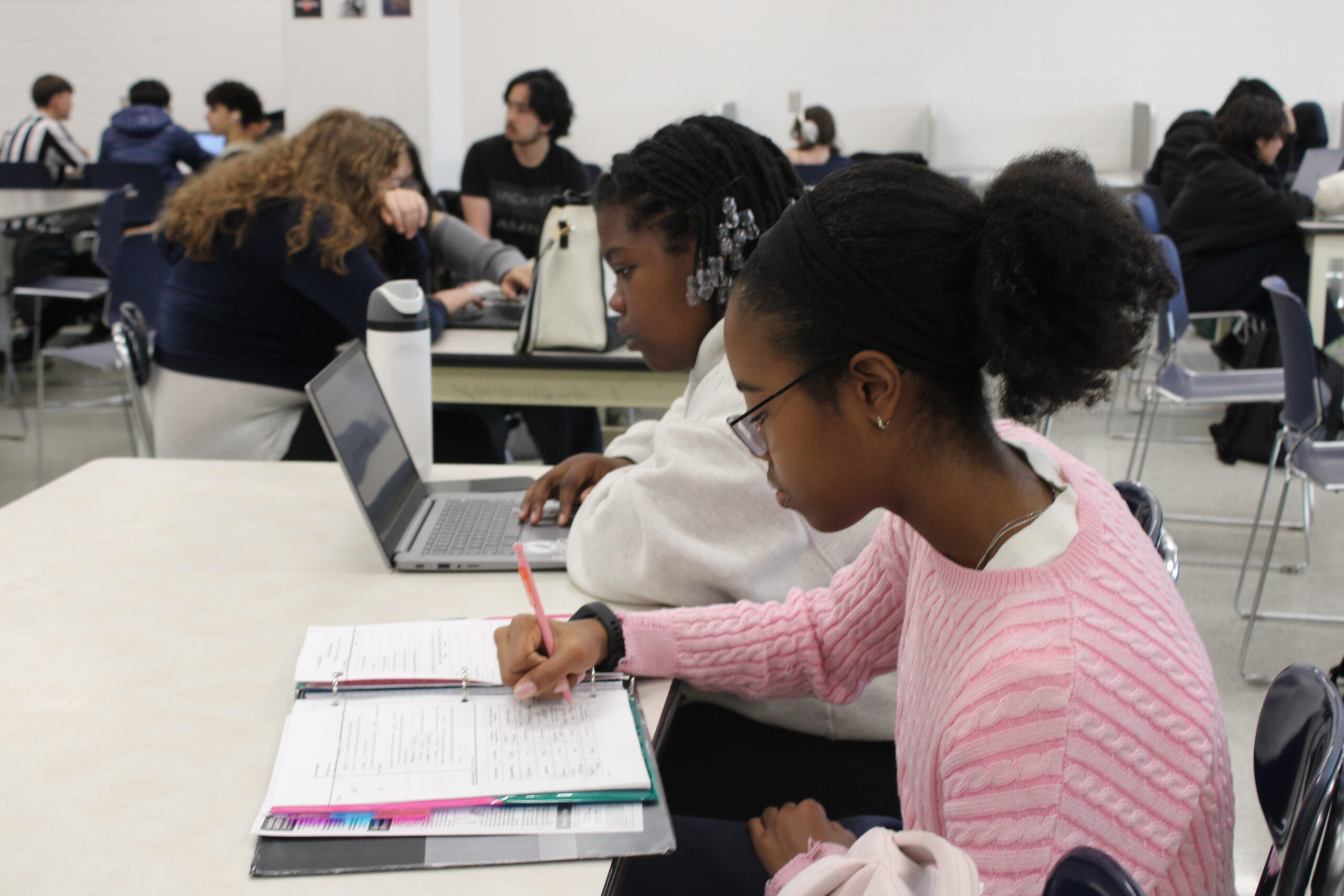 Ruby Neicth Forbes and Hadassa Pierre-Rene completing assigned work for an absent teacher during SSC. FATIMA HUSAIN